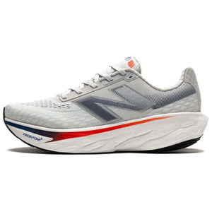 Light grey New Balance running shoe shown from the side profile, featuring a dark blue "N" logo and a thick white Fresh Foam X midsole with a red gradient stripe accent