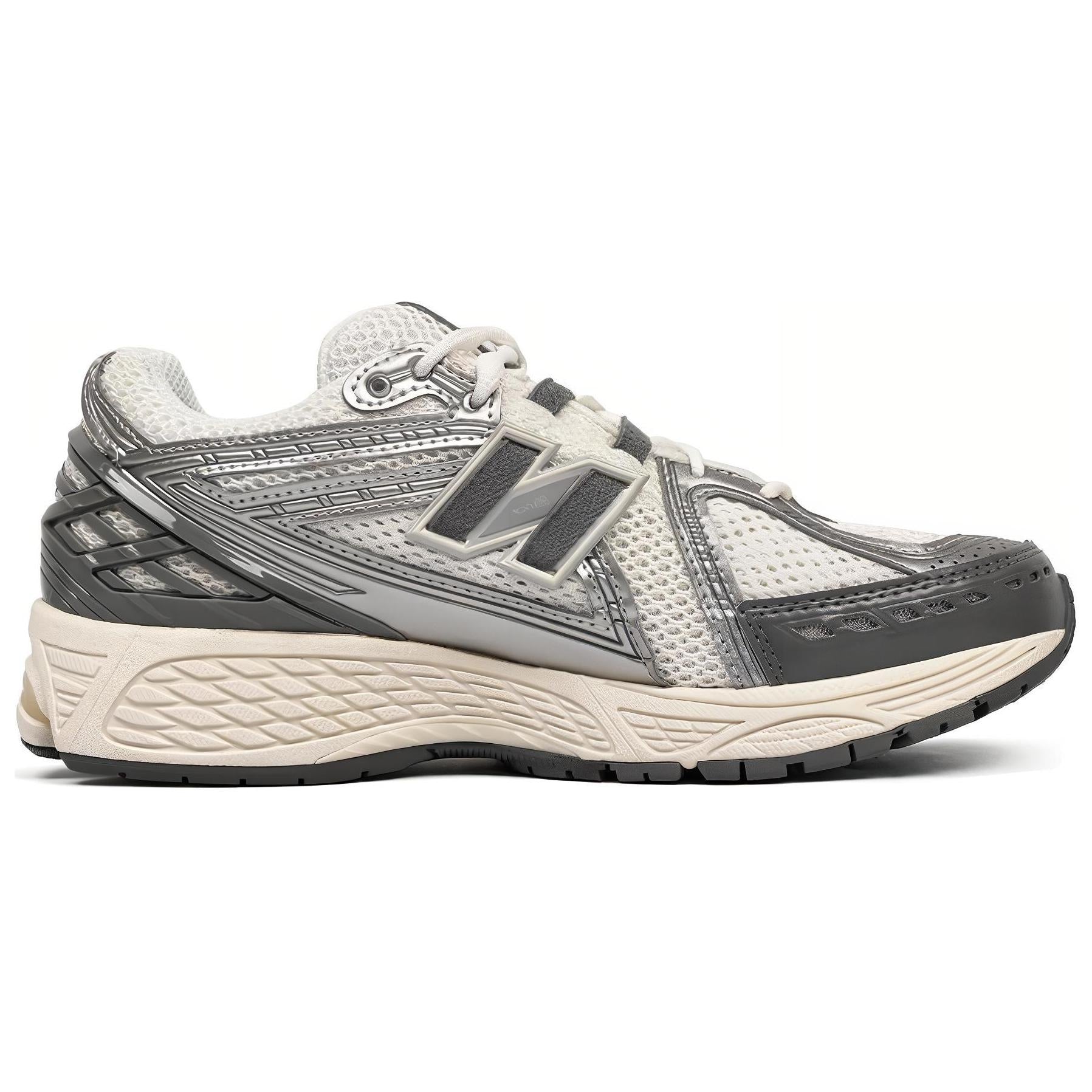 Medial side profile view of metallic silver and cream New Balance shoes 1906R.