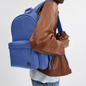 Side view of a man wearing an authentic Coach Westway 32 blue leather backpack, perfect for back-to-school and casual styling.
عرض جانبي لرجل يرتدي حقيبة ظهر كوتش ويست واي 32 أصلية جلد باللون الأزرق، مناسبة للعودة للمدرسة والإطلالات العصرية.