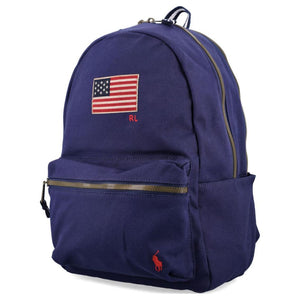 Side angle view of an original Ralph Lauren navy blue backpack with US flag patch and durable canvas design for school essentials.
عرض من الزاوية الجانبية لحقيبة ظهر رالف لورين باللون الكحلي أصلية مع رقعة العلم الأمريكي وتصميم القماش المتين لمستلزمات المدرسة.