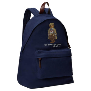 Side angle view of an original Ralph Lauren Polo Bear navy blue backpack showing brown leather zipper pulls and durable canvas fabric for school essentials.
عرض من الزاوية الجانبية لحقيبة ظهر Ralph Lauren Polo Bear كحلي أصلية يوضح أشرطة السحاب من الجلد البني والقماش المتين لمستلزمات المدرسة.
