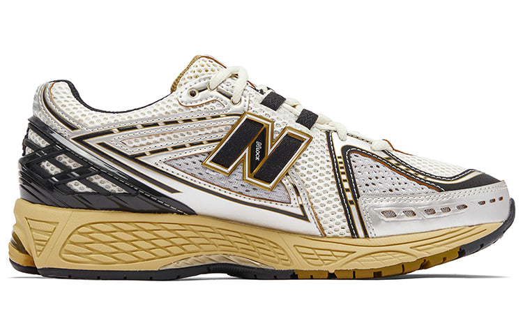 حذاء New Balance 1906R باللون الذهبي والأسود حذاء رياضي