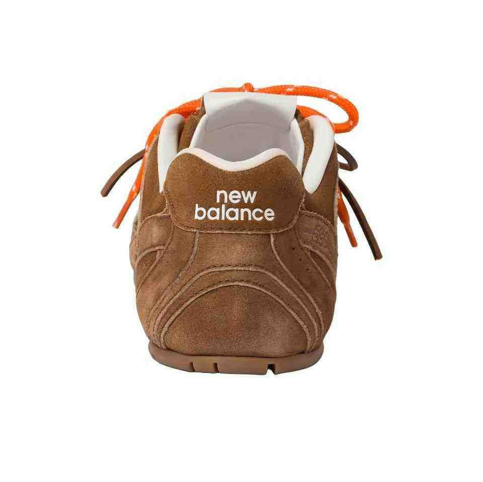 Front view close-up of brown suede New Balance x Miu Miu shoes with double-lacing detail.