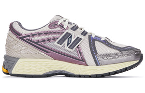 Medial side profile of grey and purple New Balance shoes 1906R model, featuring light grey mesh uppers, metallic mauve and slate overlays, silver toe caps, grey N-Lock support webbing, and a cream N-ergy cushioned midsole.