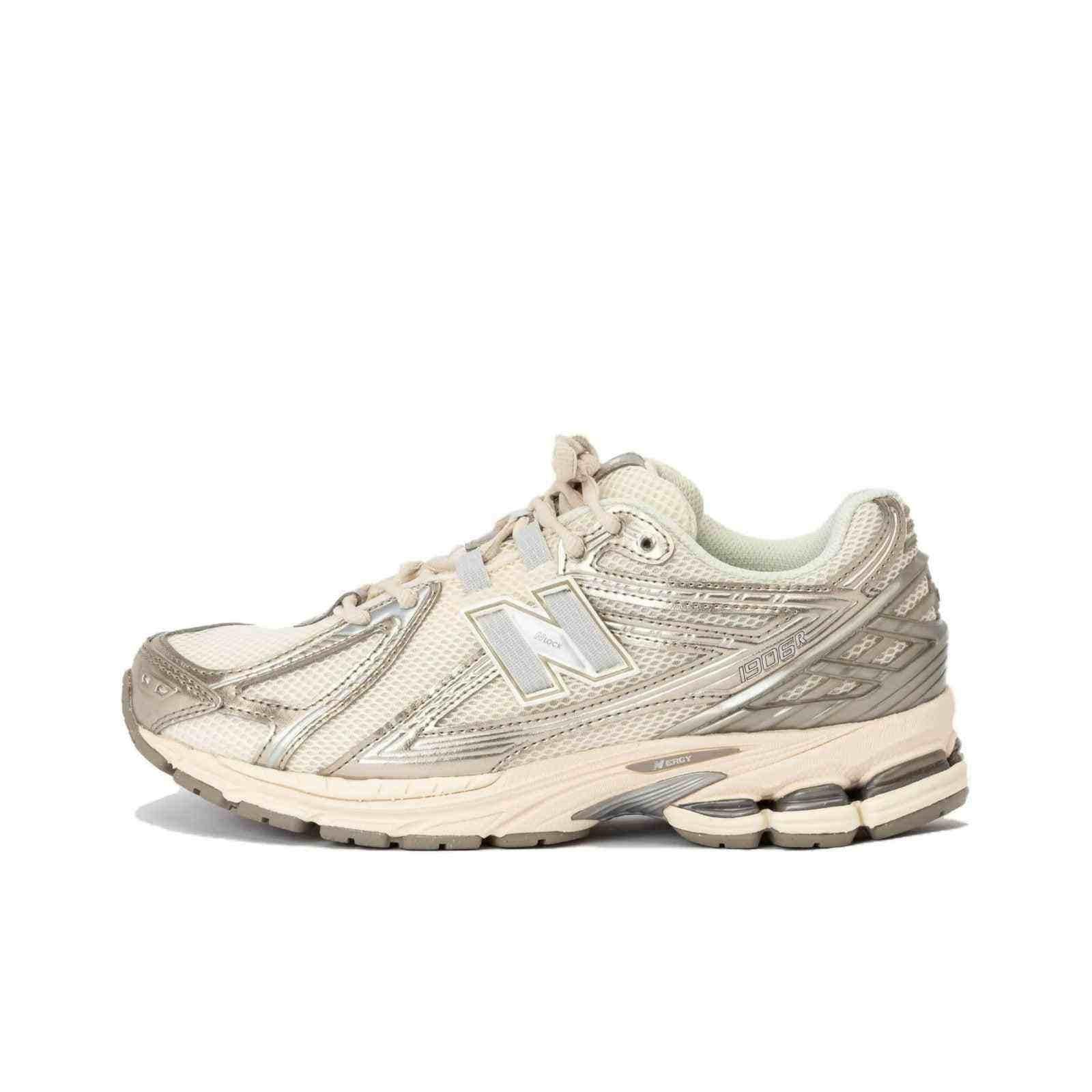Medial side view profile of cream and metallic silver New Balance running shoes