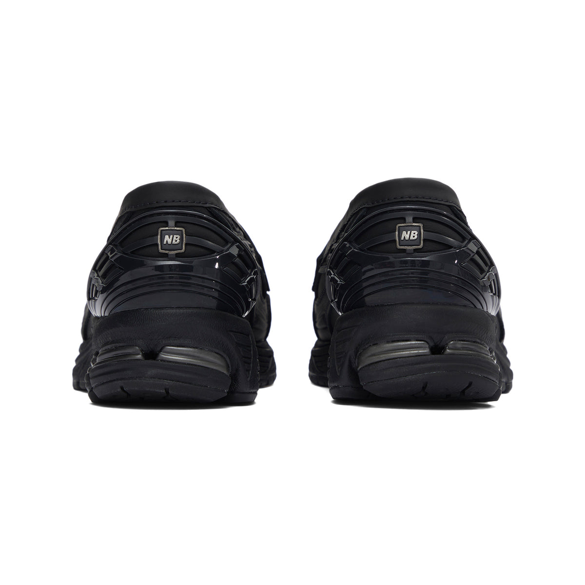 Rear angle display of حذاء نيو بالانس highlighting the structured heel and cushioned midsole design.